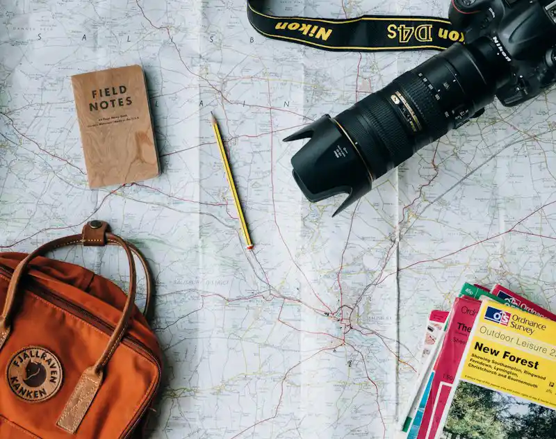 Traveller planning a trip with a map